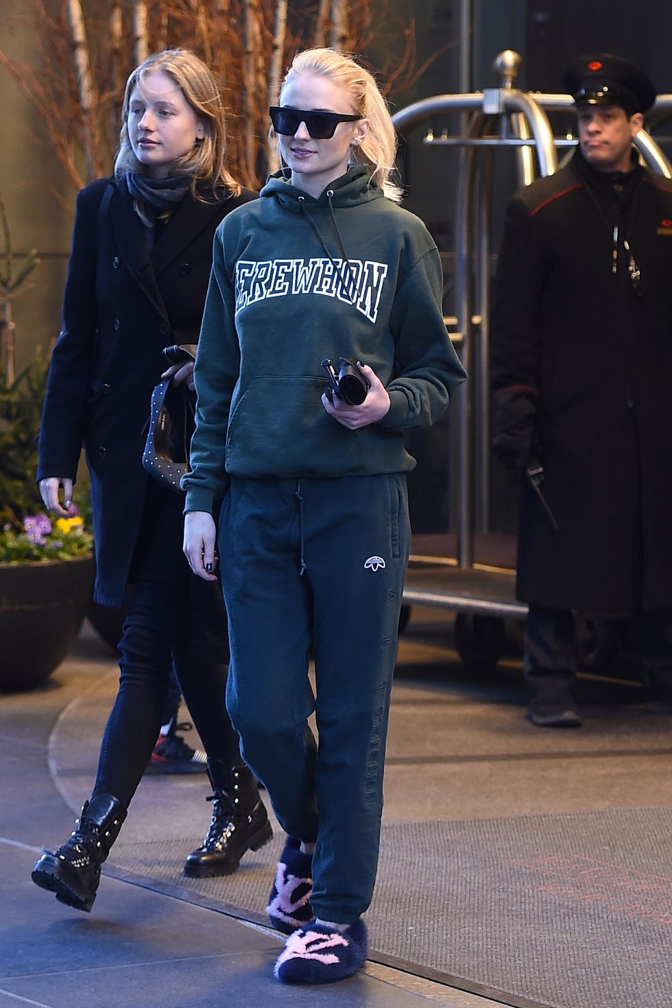 sophie turner steps out in green sweats and louis vuitton slippers