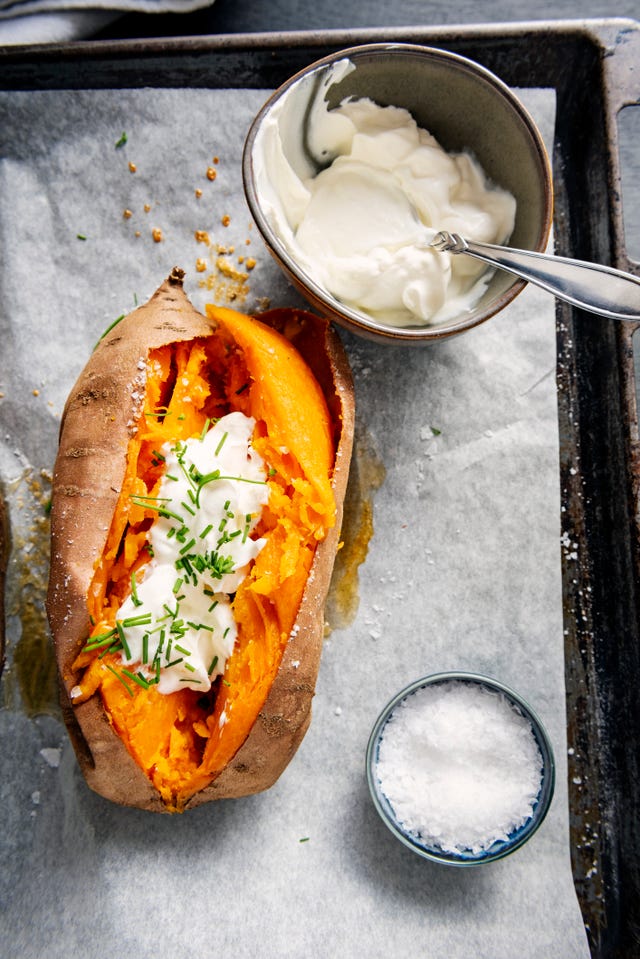 Baked sweet potato with sour cream, chives.