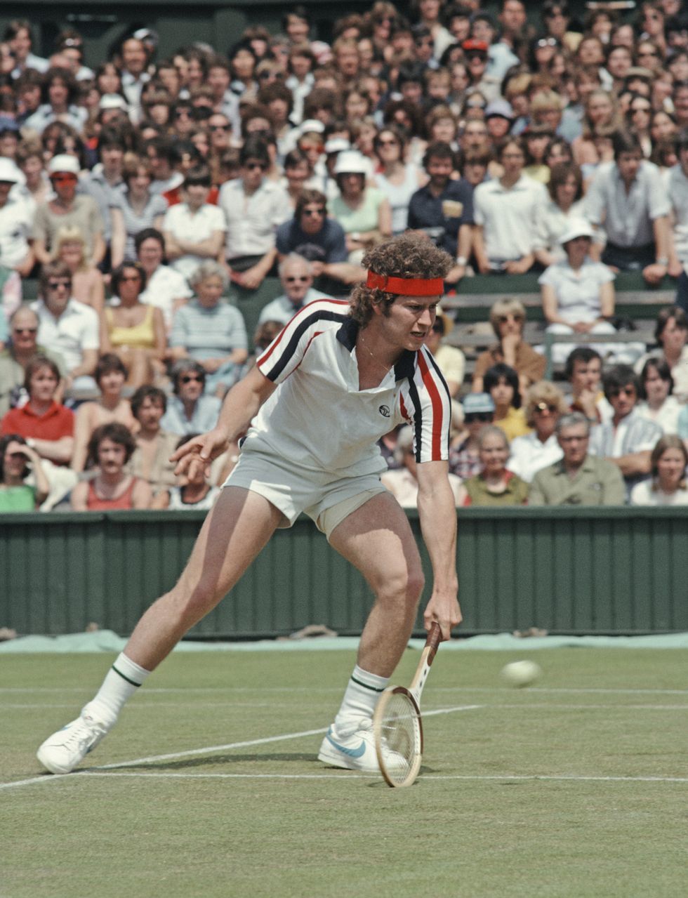 john mcenroe of the united states makes a low forehand return against buster mottram during their mens singles second round match at the wimbledon lawn tennis championship on 27 june 1979 at the all england lawn tennis and croquet club in wimbledon in london, england  photo by tony duffyallsportgetty images