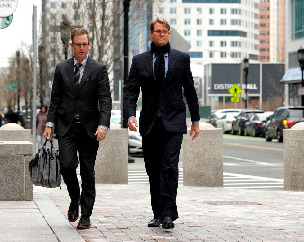 mark riddell r arrives for a court hearing at the john joseph moakley united states courthouse in boston on april 12, 2019   riddell is expected to plead guilty on charges of   conspiracy to commit mail fraud and honest services mail fraud and conspiracy to commit money laundering, in the college admissions scandal riddell was allegedly was paid to pose as a high school students and take the sats and acts college admission tests photo by joseph prezioso  afp        photo credit should read joseph preziosoafp via getty images