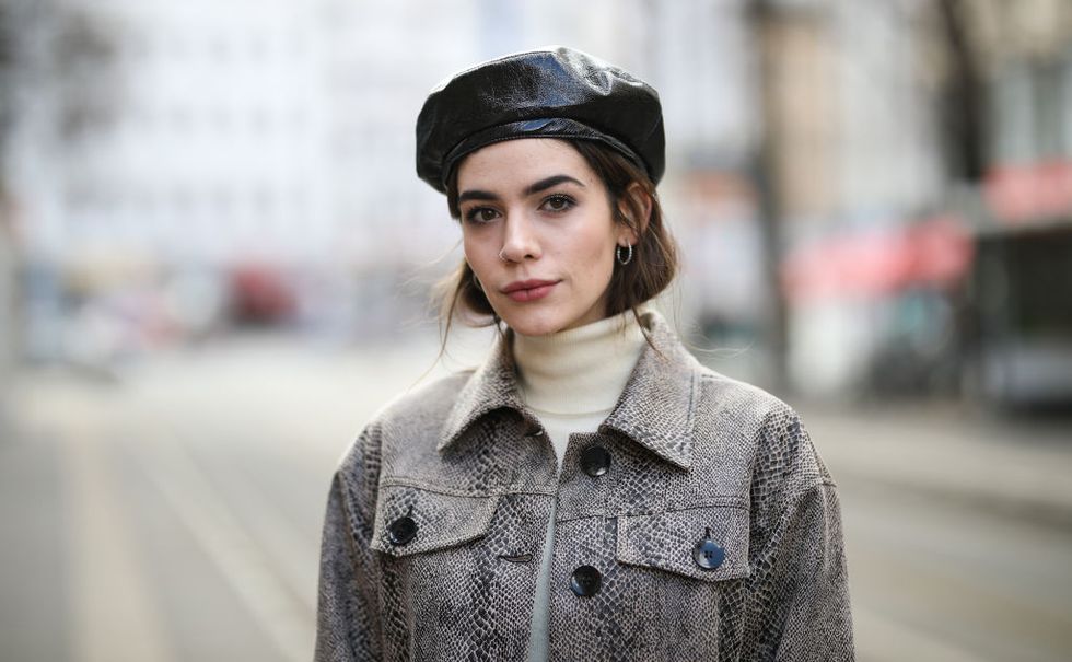 berlin, germany   march 19 frankie miles wearing animal print twinset jacket and skirt reserved snake print, turtleneck s oliver, hat topshop on march 19, 2019 in berlin, germany photo by jeremy moellergetty images