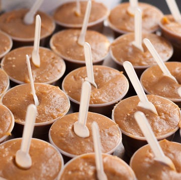 Dulce de leche street food food stall selling cups of dulce de leche on the street
