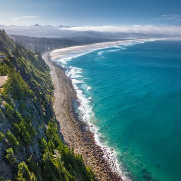 aerial view of the scenic coastline and highway 101, by the western shoulder of neah kah nie mountain, in oregon, united states