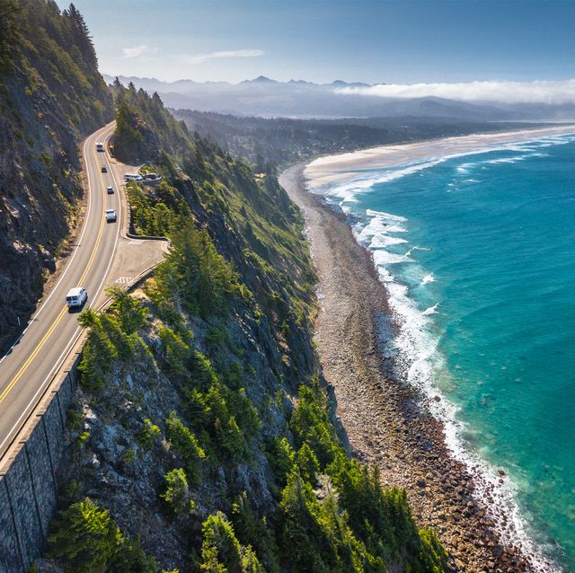 aerial view of the scenic coastline and highway 101, by the western shoulder of neah kah nie mountain, in oregon, united states