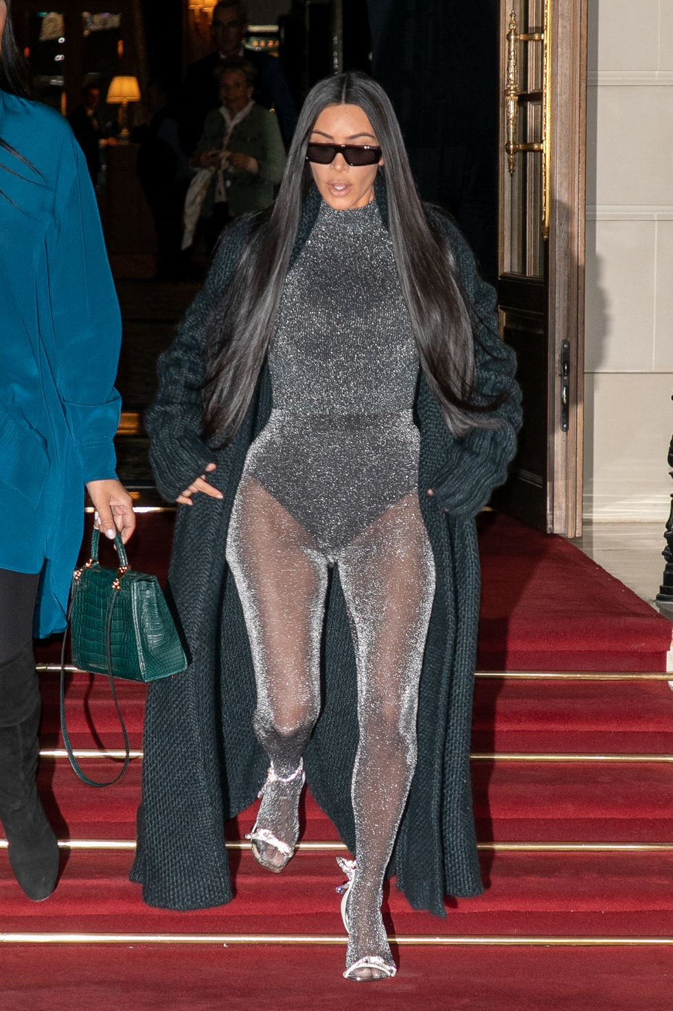 Kim Kardashian shows off her figure in sheer SKIMS bodysuits