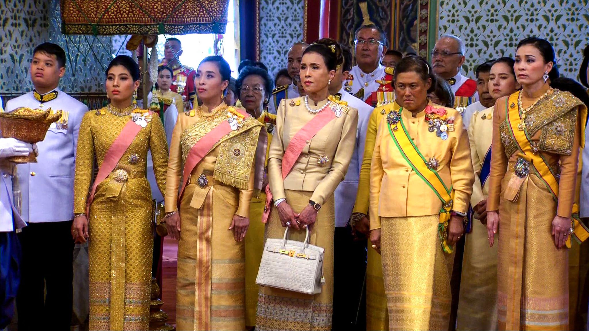 topshot   this screengrab from thai tv pool video taken on may 4, 2019 shows family members of thailands king maha vajiralongkorn from left, son prince dipangkorn rasmijoti, daughter princess sirivannavari nariratana, daughter princess bajrakitiyabha manidol, sister princess ubolratana, sister princess maha chakri sirindhorn and queen suthida r attending the coronation of king vajiralongkorn at the grand palace in bangkok photo by    thai tv pool  afp  the erroneous mentions appearing in the metadata of this photo by handout has been modified in afp systems in the following manner adding identification of queen suthida and position in the photo please immediately remove the erroneous mentions from all your online services and delete it them from your servers if you have been authorized by afp to distribute it them to third parties, please ensure that the same actions are carried out by them failure to promptly comply with these instructions will entail liability on your part for any continued or post notification usage therefore we thank you very much for all your attention and prompt action we are sorry for the inconvenience this notification may cause and remain at your disposal for any further information you may require   photo by  thai tv poolafp via getty images
