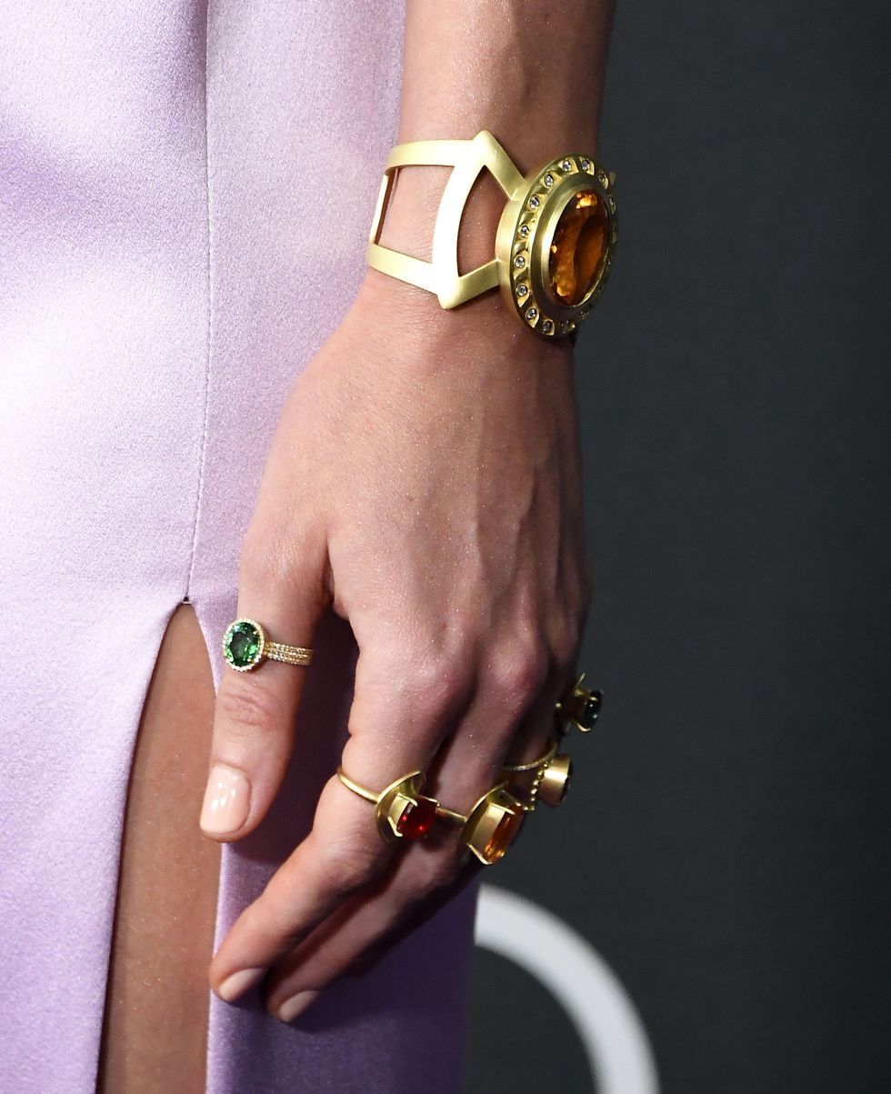 Bracelet, Fashion accessory, Bangle, Jewellery, Yellow, Finger, Hand, Arm, Wrist, Metal, 