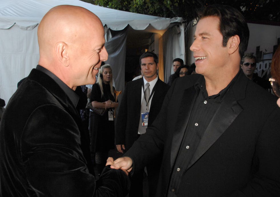 bruce willis and john travolta during 2007 mtv movie awards backstage and audience at gibson amphitheater in los angeles, california, united states. ***exclusive*** (photo by jeff kravitz/filmmagic, inc)