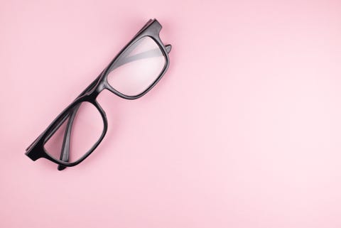 Directly Above View Of Eyeglasses On Pink Background