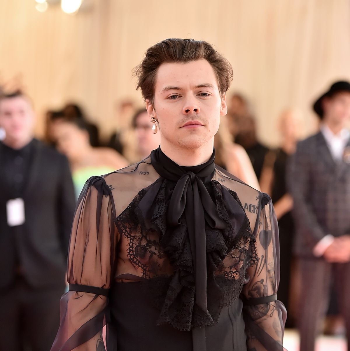 Harry Styles appears in fishnets on the cover of Beauty Papers magazine