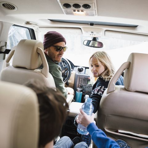 Family on road trip, riding in SUV