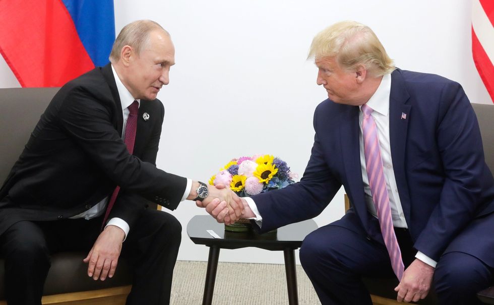 osaka, japan   june 28     editorial use only  mandatory credit   kremlin press office   handout   no marketing no advertising campaigns   distributed as a service to clients     us president donald trump r meets russian president vladimir putin l on the first day of the g20 summit in osaka, japan on june 28, 2019 photo by kremlin press office  handoutanadolu agencygetty images
