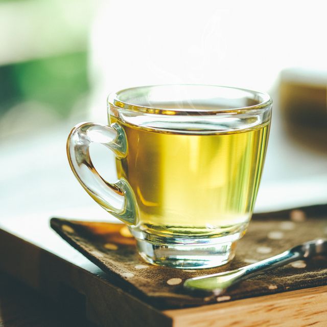close up of green tea in cup on table