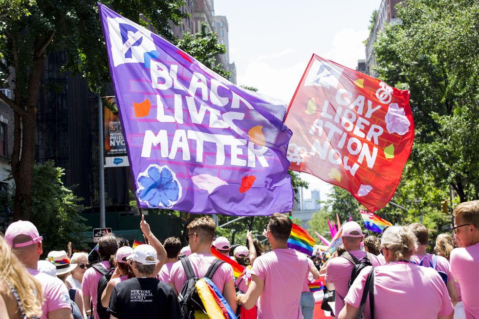 black lives matter and gay liberation flags are waved at the annual pride parade on sunday, june 29, 2019 in new york, ny this years annual pride parade celebrates the 50th anniversary of the stonewall uprising and a half century of lgbtq liberation photo by erin lefevrenurphoto via getty images