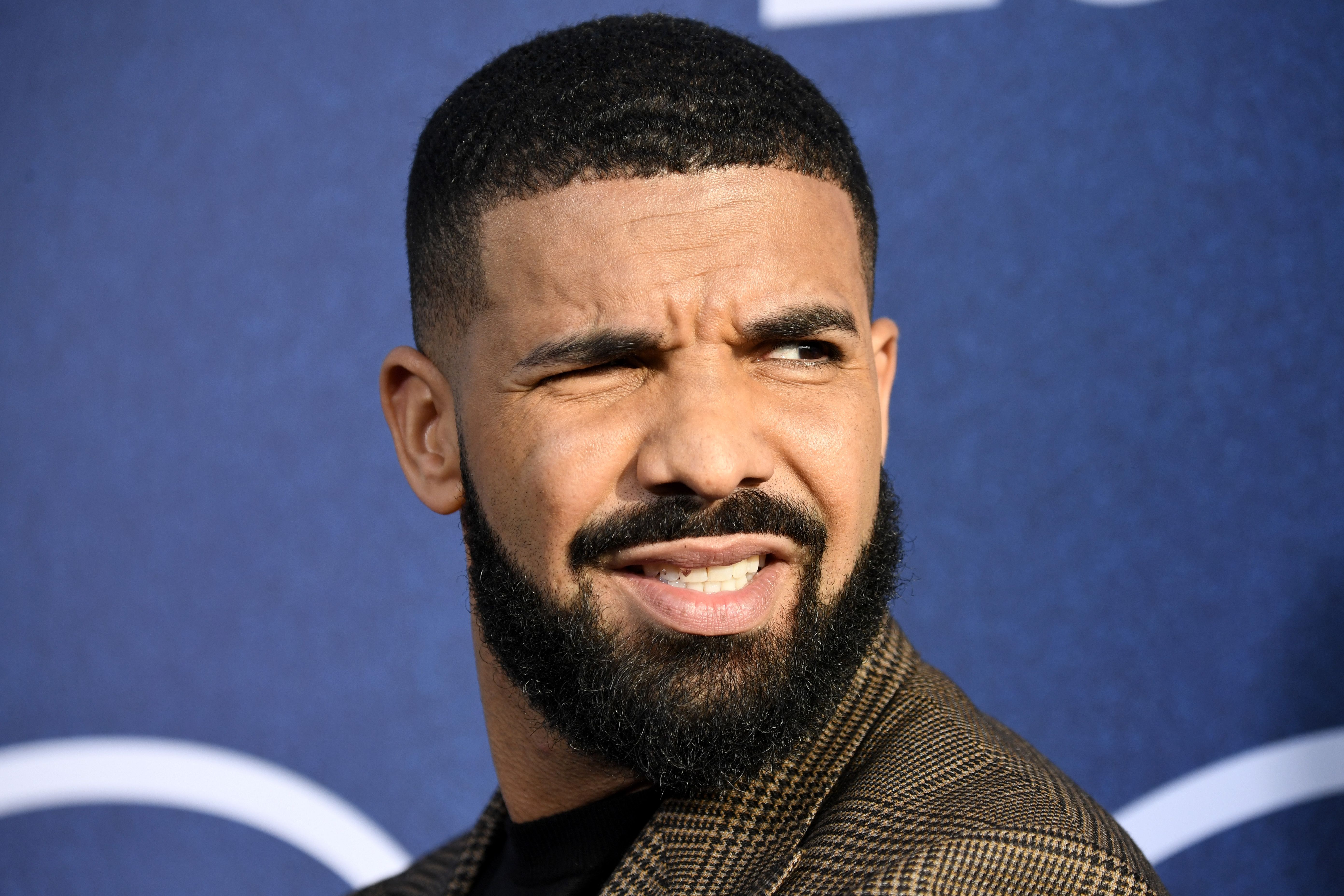 Drake Gets Tattoo of His Son's Name on the Back of His Neck - XXL