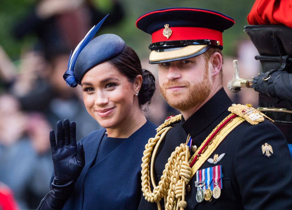 london, england   june 08 prince harry, duke of sussex and meghan, duchess of sussex ride by carriage down the mall during trooping the colour, the queens annual birthday parade, on june 08, 2019 in london, england photo by samir husseinsamir husseinwireimage