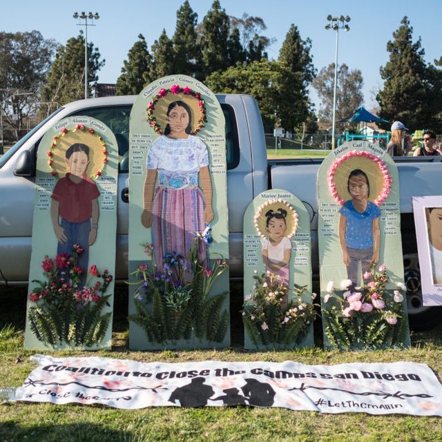 Portraits of dead immigrants during the protest.
 Over one