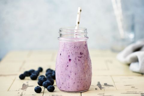 blueberry smoothie in bottle with drinking straw fresh delicious berry smoothie vegan, vegetarian diet concept, clean eating and weight loss