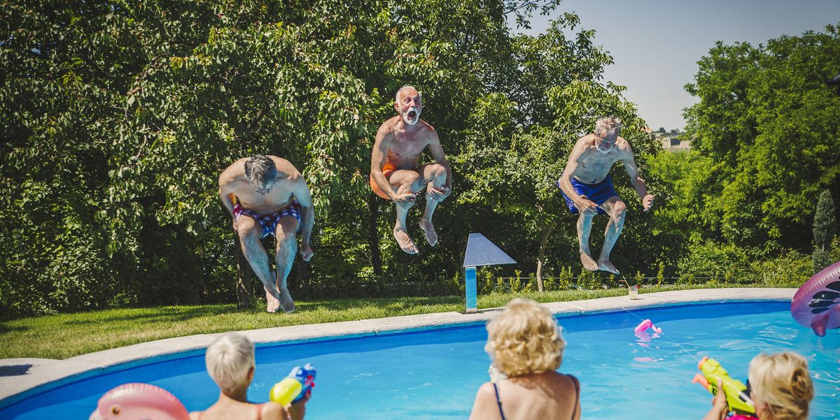 active seniors having fun at swimming pool