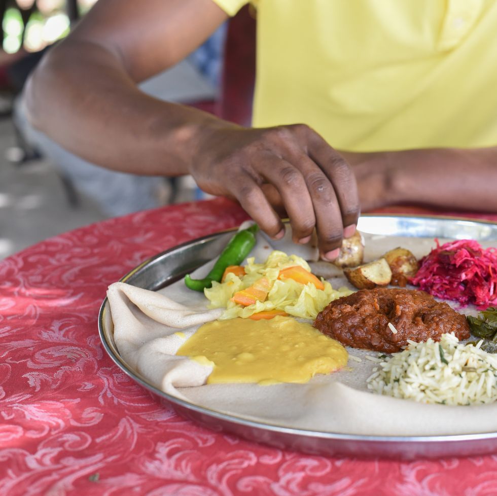man having ethiopian food in addis ababa