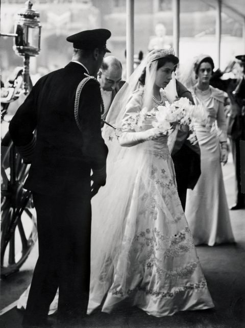 princess elizabeth arrives at westminster abbey
with her father on her wedding day