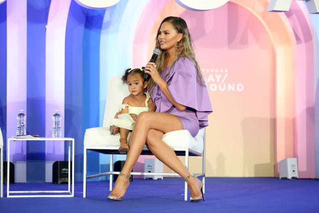 new york, new york   june 23 luna legend joins chrissy teigen  onstage during popsugar playground at pier 94 on june 23, 2019 in new york city photo by monica schippergetty images for popsugar and reed exhibitions