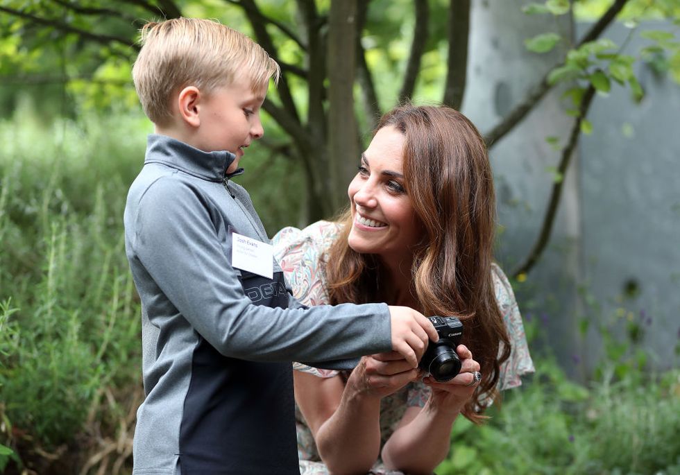 kingston, england   june 25 catherine, duchess of cambridge speaks with josh evans at photography workshop for action for children, run by the royal photographic society at warren park on june 25, 2019 in kingston, england photo by chris jacksongetty images