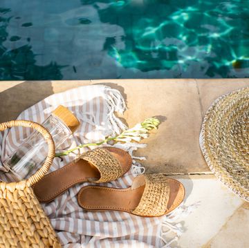 a pair of sandals by a pool