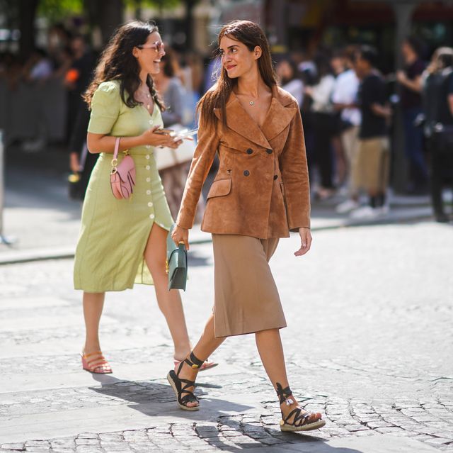 paris, france   july 01 gala gonzalez wears a christian dior tan color suede jacket, a green christian dior bag, light camel bermuda shorts, black gladiator espadrilles, outside dior, during paris fashion week  haute couture fallwinter 20192020, on july 01, 2019 in paris, france photo by edward berthelotgetty images