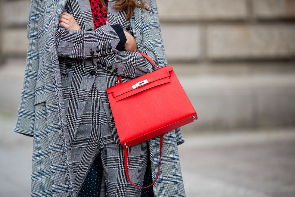 berlin, germany   july 02 alexandra lapp is seen wearing a total look by steffen schraut with grey checkered coat, grey checkered suit and red leopard blouse, red hermès kelly bag during mercedes benz fashion week berlin on july 02, 2019 in berlin, germany photo by christian vieriggetty images