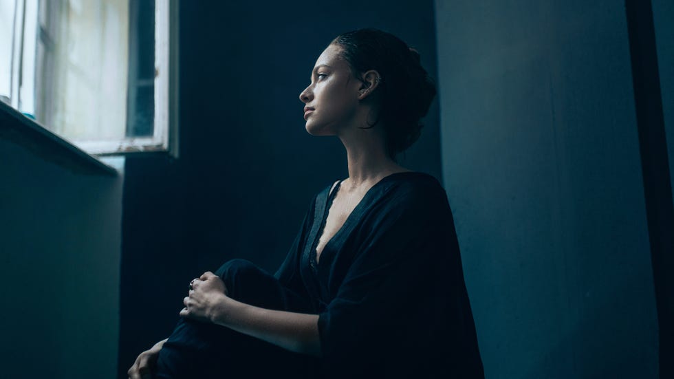 portrait of young caucasian woman posing in studio