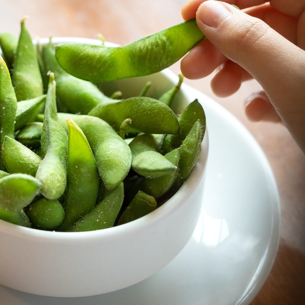 POV, Salted Edamame Beans, Eating Japanese Food by Hand personal perspective of a diner eating a japanese meal