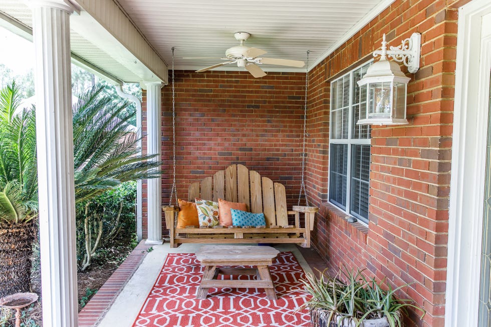 fall porch decor, wood porch swing with throw pillows