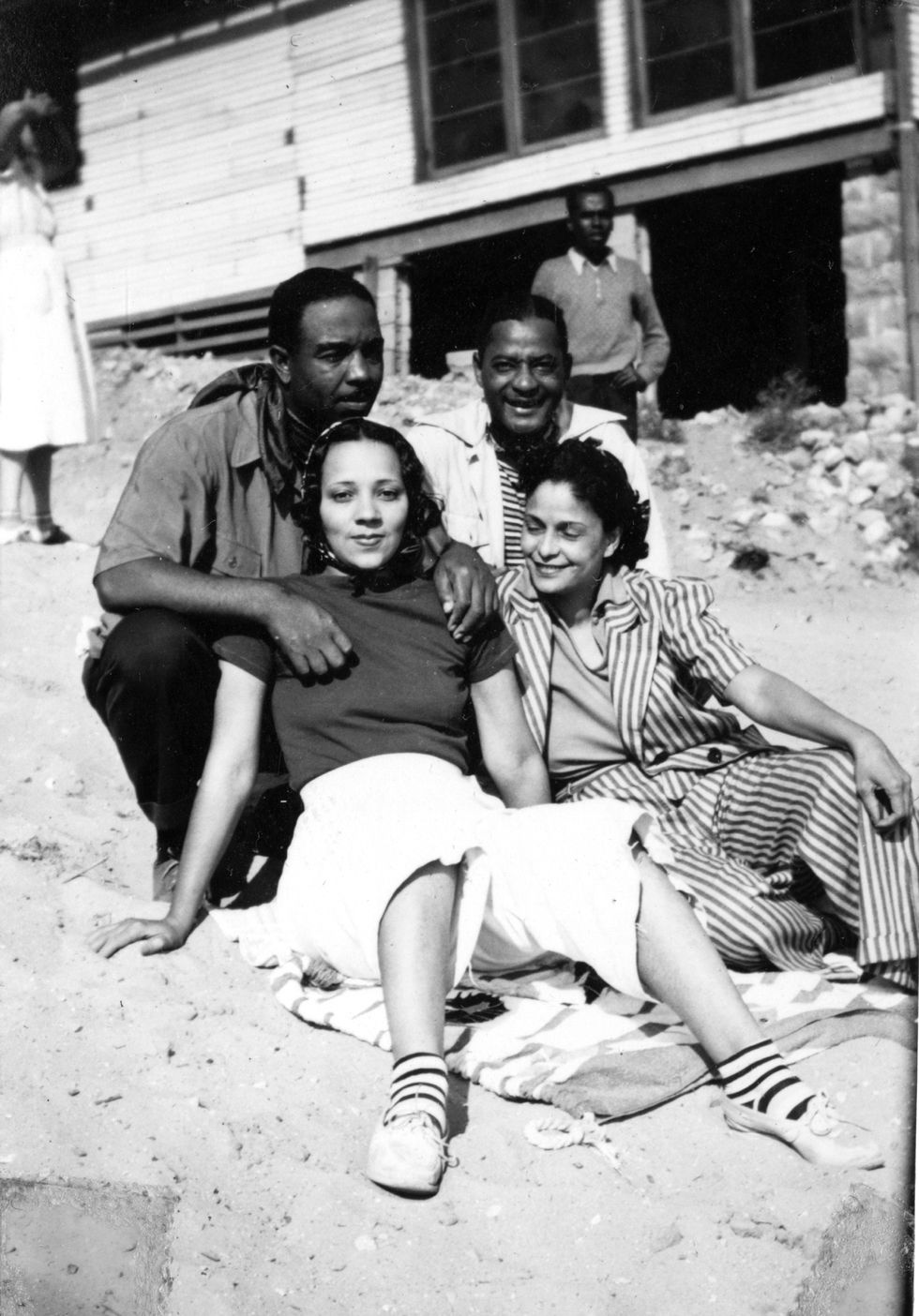 portrait of four unidentified people friends andor family members of future newspaper publisher john h sengstacke as they pose on the beach outside the idlewild club house, idlewild, michigan, september 1938 idlewild, known as the black eden, was a resort community that catered to african americans, who were excluded from other resorts prior to the passage of the civil rights act of 1964 photo by the abbott sengstacke family papersrobert abbott sengstackegetty images
