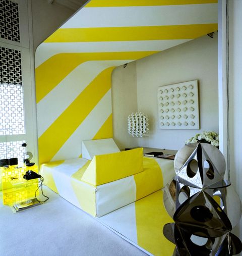 vogue, february 15, 1970   the bedroom in the paris apartment of betty catroux, model, and her husband, francois catroux, interior designer the op art style bed was designed by catroux himself, with a graphic bedcover in a yellow and white striped design that continues onto the back wall and floor the silver sculpture in the foreground was done by cleto munari, the white on white relief on the wall by luis tomasello, and the white sculpture in the back corner by duarte horst p horstconde nast via getty images