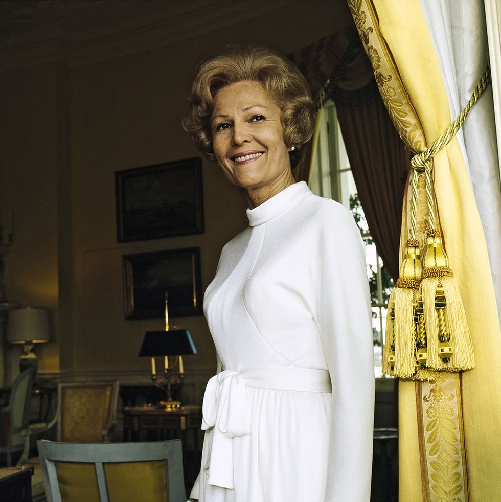 vogue, october 15, 1972   portrait of pat nixon nee thelma catherine patricia ryan first lady of the united states and wife of president richard milhous nixon, standing in the yellow oval room of the white house next to a yellow curtain held back by large tassels she wears a white dress with long sleeves, a standing collar, and a tie belted waist  horst p horstconde nast via getty images