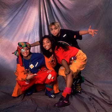 TLC Backstage On The Oprah Winfrey Show the members of american hip hop and rb group tlc pose backstage during an appearance on an episode of the oprah winfrey show, chicago, illinois, november 17, 1992. pictured are, lisa 'left eye' lopes (1971 2002) (in blue and orange), tionne 't boz' williams (blond hair), and rozanda 'chilli' thomas. (photo by paul natkin/getty images)