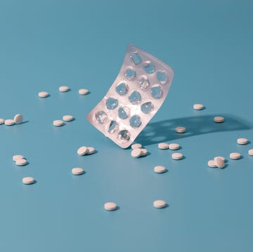 running and painkillers an empty blister pack surrounded by pills