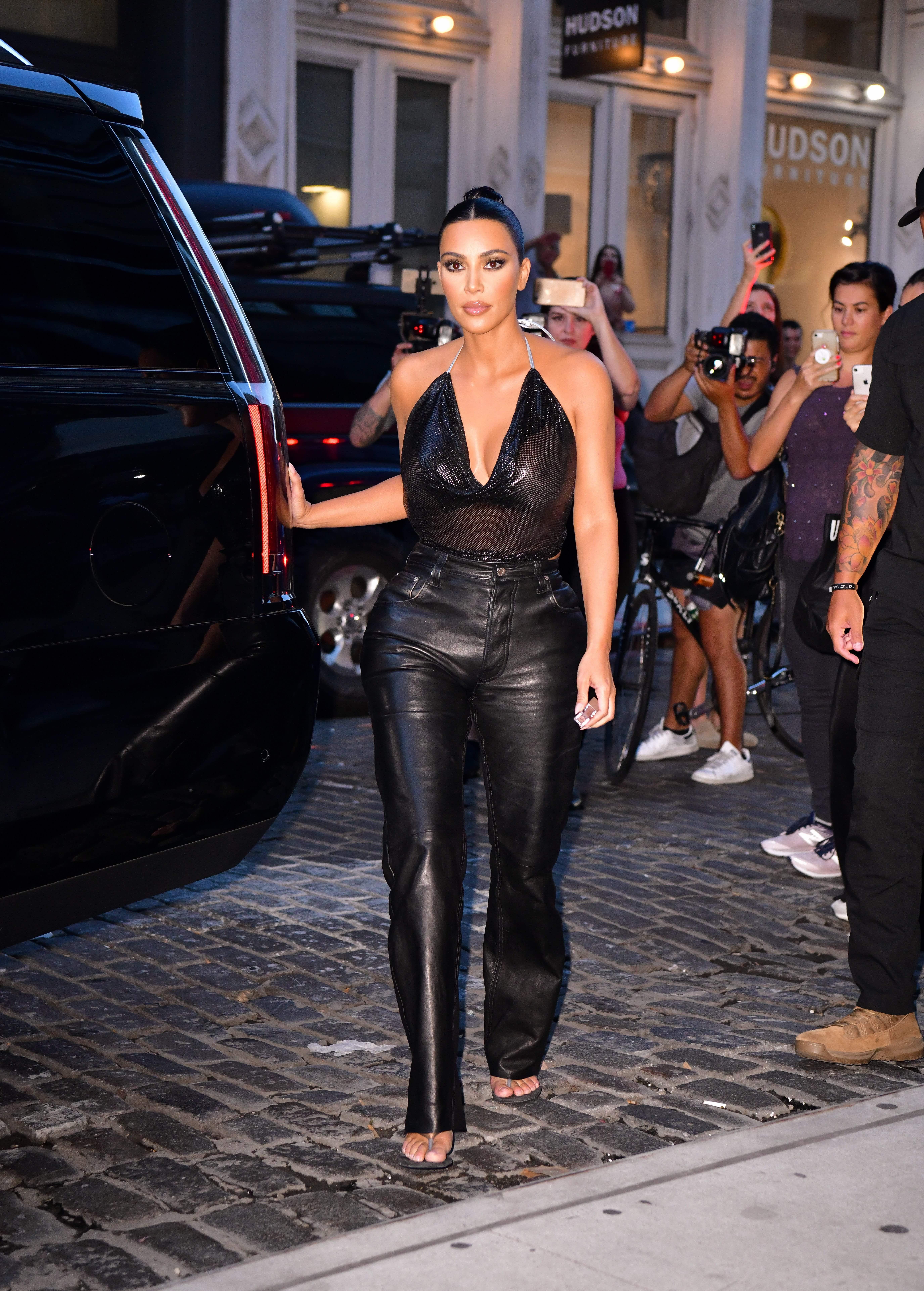 Kim Kardashian West can't stop wearing these flashy leather pants