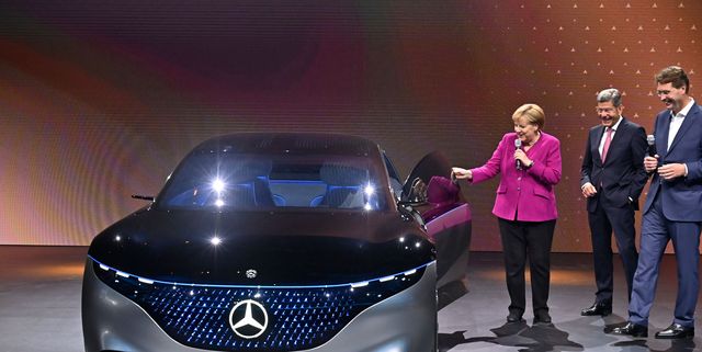 german chancellor angela merkel shares a smile with the ceo of german car maker daimler ola kaellenius r and bernhard mattes c, president of the german association of the automotive industry vda, next to a mercedes vision eqs car at the booth of daimler as she tours the fair grounds after officially opening the international auto show iaa in frankfurt am main, western germany, on september 12, 2019   frankfurts biennial international auto show iaa opens its doors to the public, but major foreign carmakers are staying away while climate demonstrators march outside    forming a microcosm of the under pressure industrys woes photo by tobias schwarz  afp        photo credit should read tobias schwarzafp via getty images