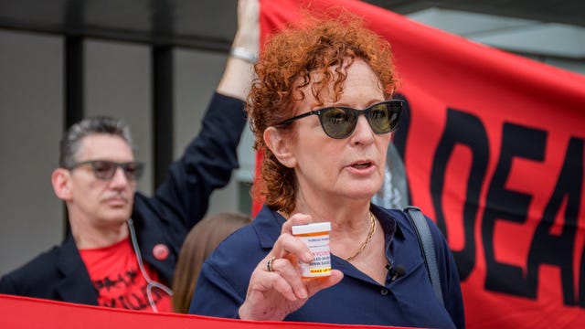 PURDUE PHARMA, STAMFORD, CT, UNITED STATES - 2019/09/12: Artist and Activist Nan Goldin - Members of P.A.I.N. (Prescription Addiction Intervention Now) and Truth Pharm staged a protest on September 12, 2019 outside Purdue Pharma headquarters in Stamford, over their recent controversial opioid settlement. Participants dropped hundreds prescription bottles of OxyContin while holding tombstones with the names of opioids casualties and banners reading "Shame on Sackler" and "200 Dead Each Day". (Photo by Erik McGregor/LightRocket via Getty Images)