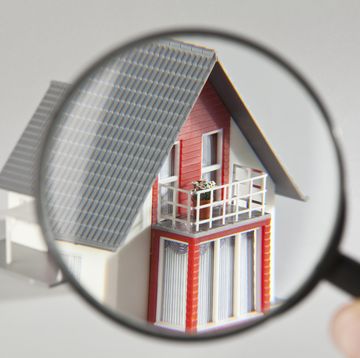 a model house viewed through a magnifying glass