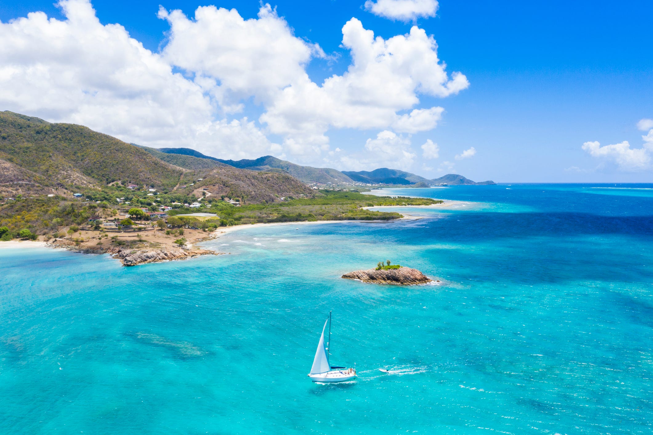 aerial view of boat sailing in the turquoise caribbean sea, urlings, antigua, antigua and barbuda, caribbean, west indies