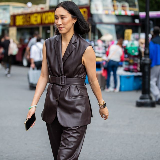 eva chen is seen wearing a brown belted leather vest and pants, along with her signature jade bracelet, during new york fashion week september 2019