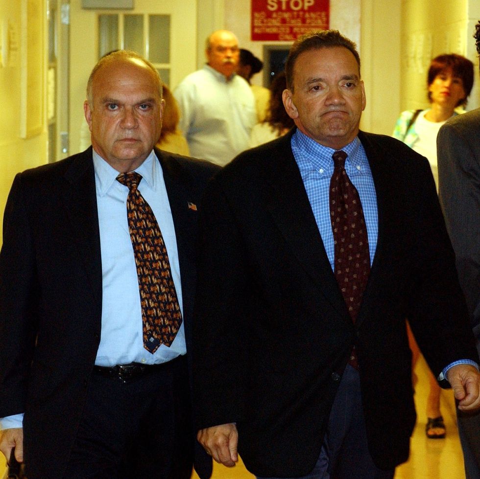 mineola, ny former roslyn school superintendent frank tassone right and his attorney john kase left appeared for a felony exam at nassau county court in mineola, new york on july 14, 2004 photo by dick yarwoodnewsday via getty images