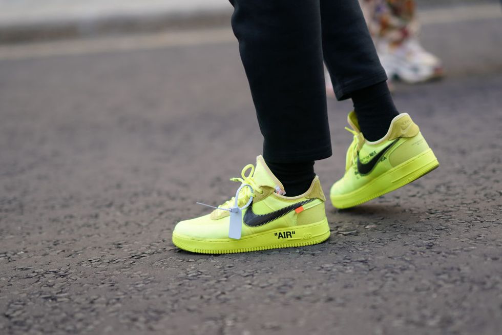 london, england   september 15 a guest wears neon yellow nike air zip tie sneakers, during london fashion week september 2019 on september 15, 2019 in london, england photo by edward berthelotgetty images