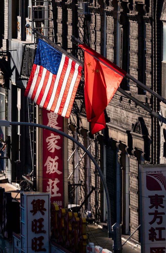 topshot   a us and chinese flag are seen in chinatown on october 14, 2019 in new york city photo by johannes eisele  afp photo by johannes eiseleafp via getty images