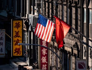 topshot   a us and chinese flag are seen in chinatown on october 14, 2019 in new york city photo by johannes eisele  afp photo by johannes eiseleafp via getty images