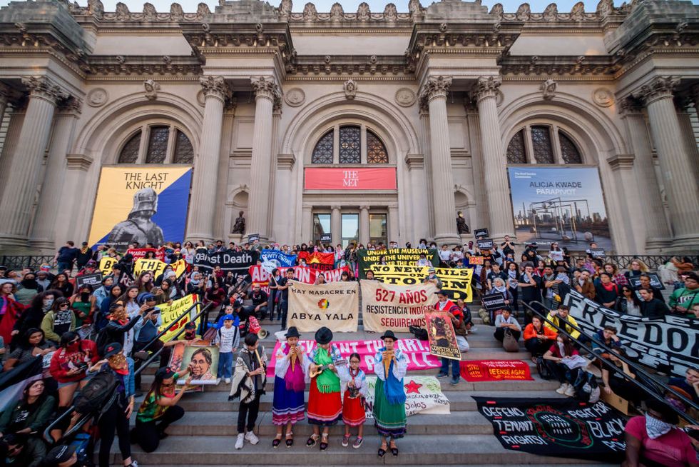 manhattan, new york, united states   20191014 a group of young indigenous artists sharing a song with the crowd at the rally outside the metropolitan museum activist group decolonize this place and a citywide coalition of grassroots groups organized the fourth anti columbus day tour the tour began at the roosevelt monument, and took to the streets moving into the city at large, joining together the movements for decolonization, abolition, anti gentrification, and demilitarization photo by erik mcgregorlightrocket via getty images