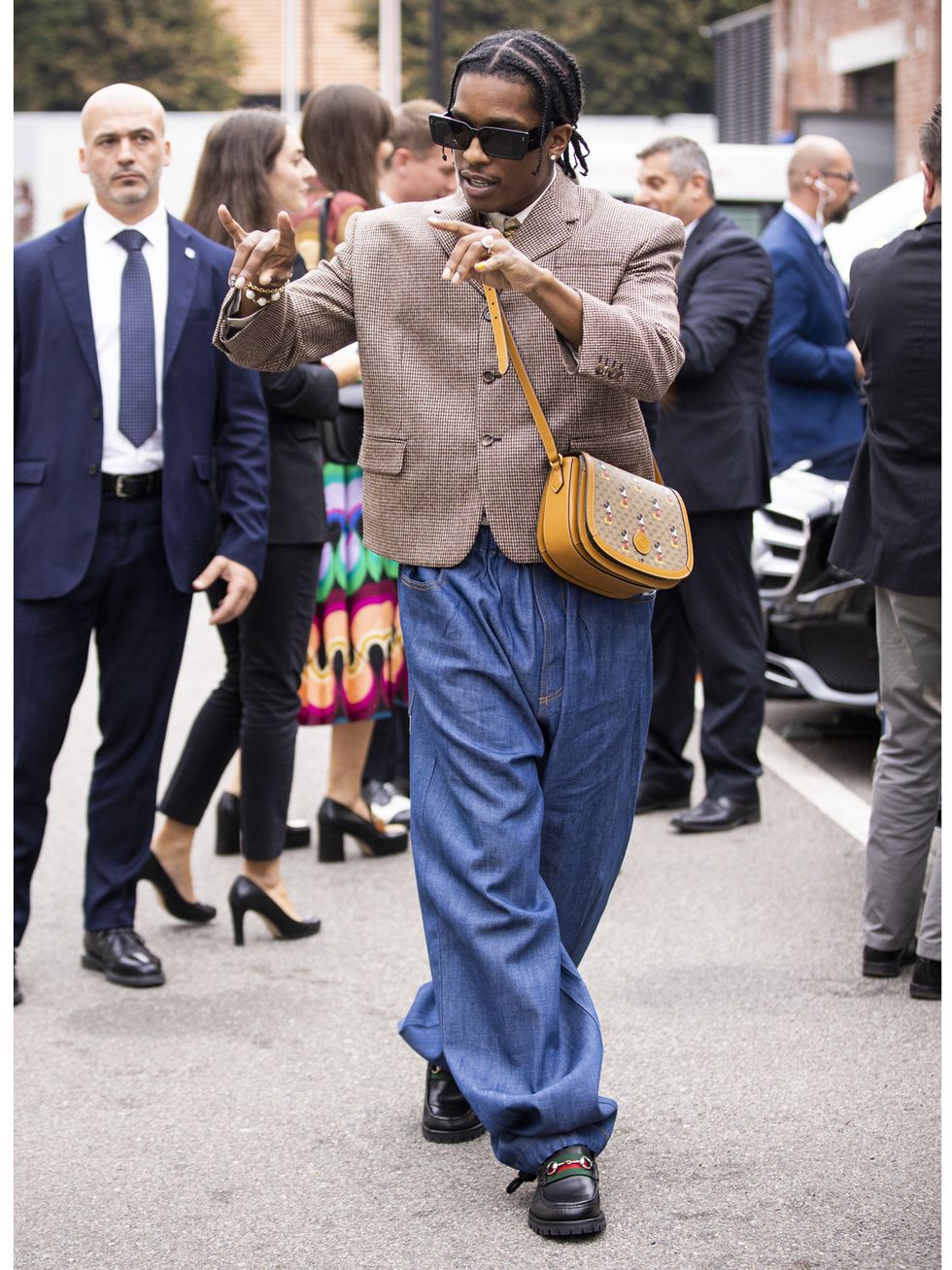 milan, italy   september 22  asap rocky, wearing brown blazer, blue jeans, gucci bag and gucci shoes, is seen outside the gucci show during milan fashion week springsummer 2020 on september 22, 2019 in milan, italy photo by claudio laveniagetty images